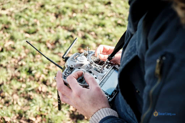 holding radio transmitter sticks